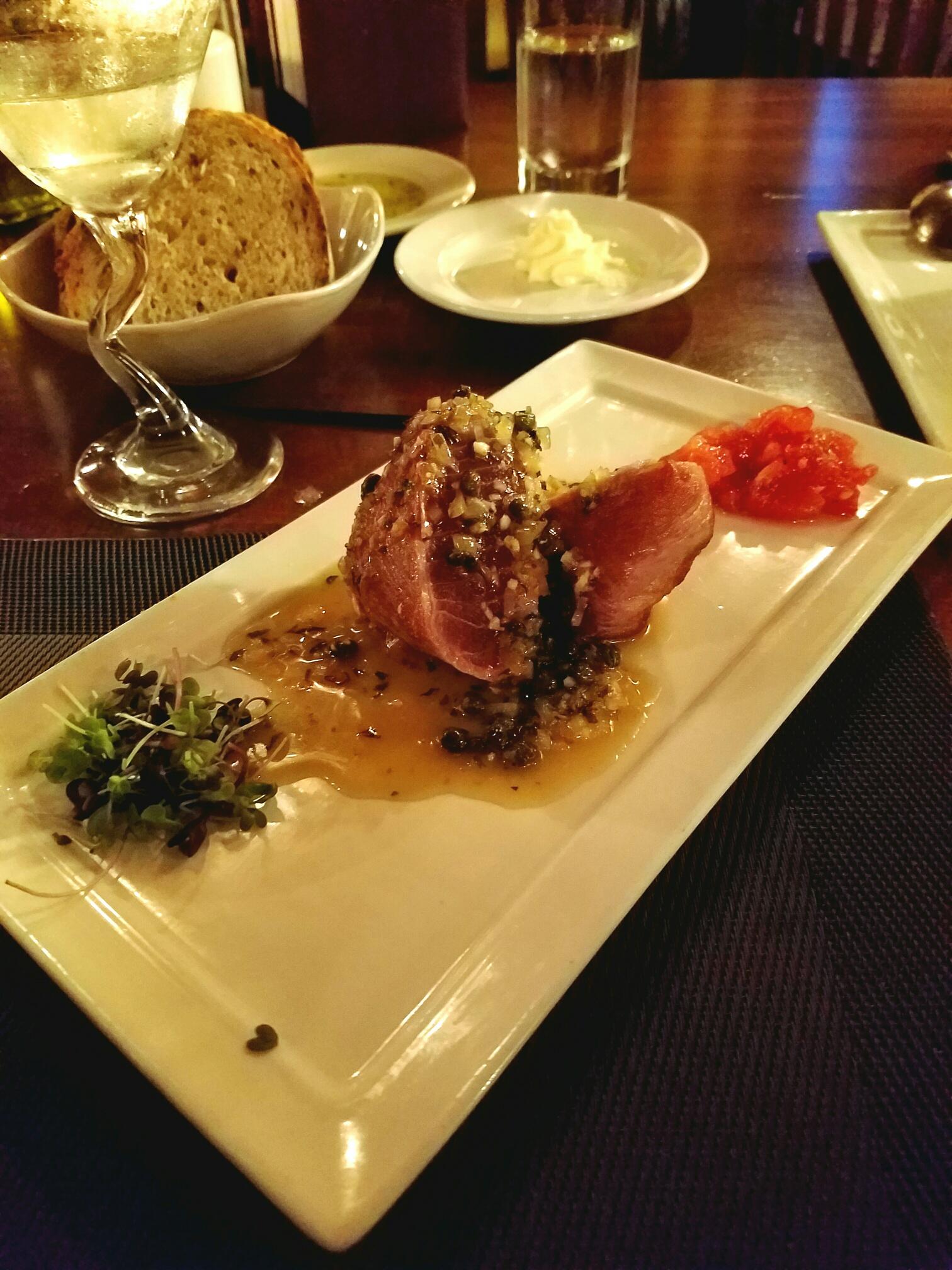 Seared Prosciutto-Wrapped Tuna with limoncello, shallots, capers, garlic butter, roasted tomatoes and micro greens ($13.50)