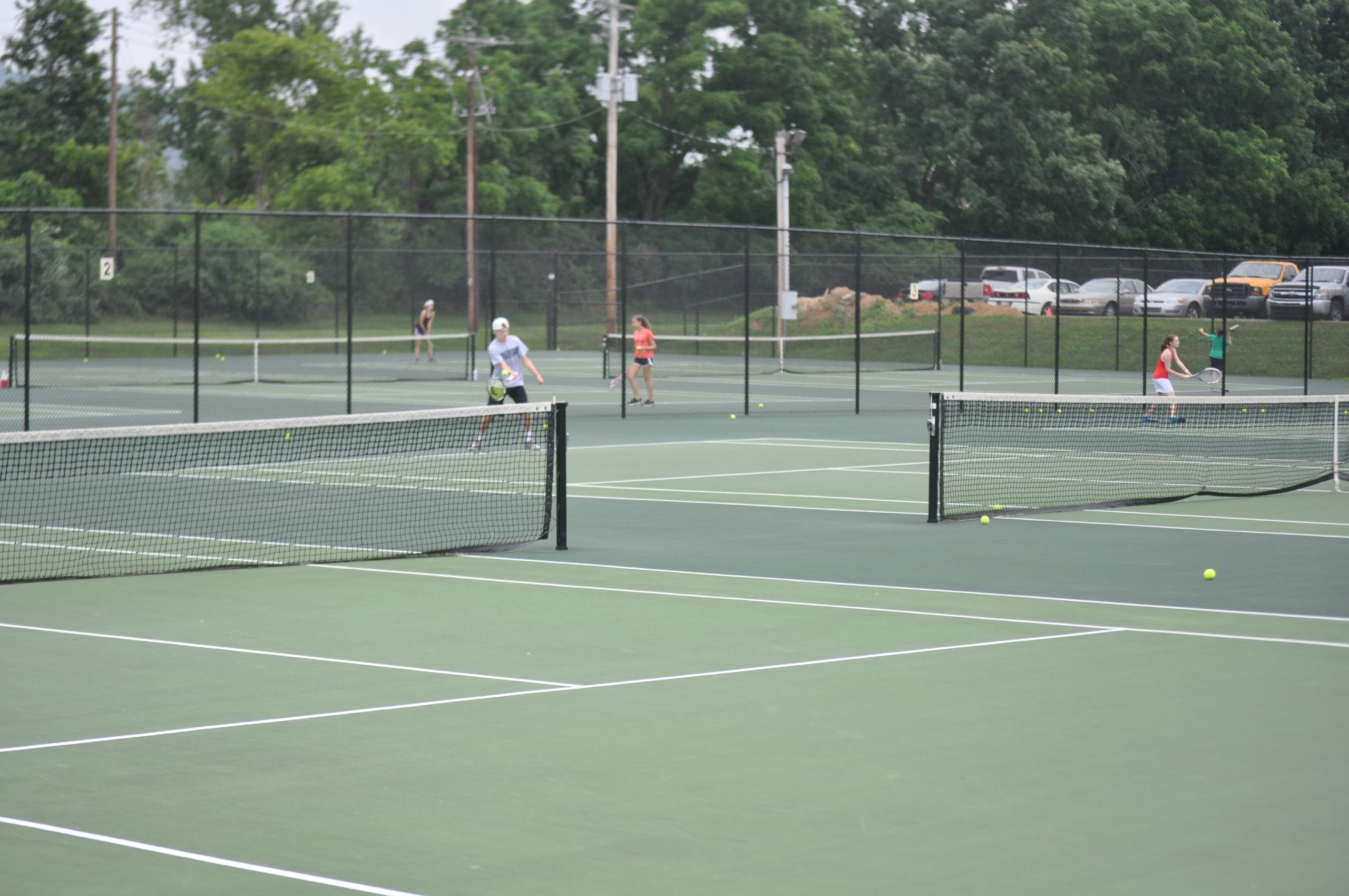 Garrett Deppert and other boys take part in Coach Ochse's open court sessions.