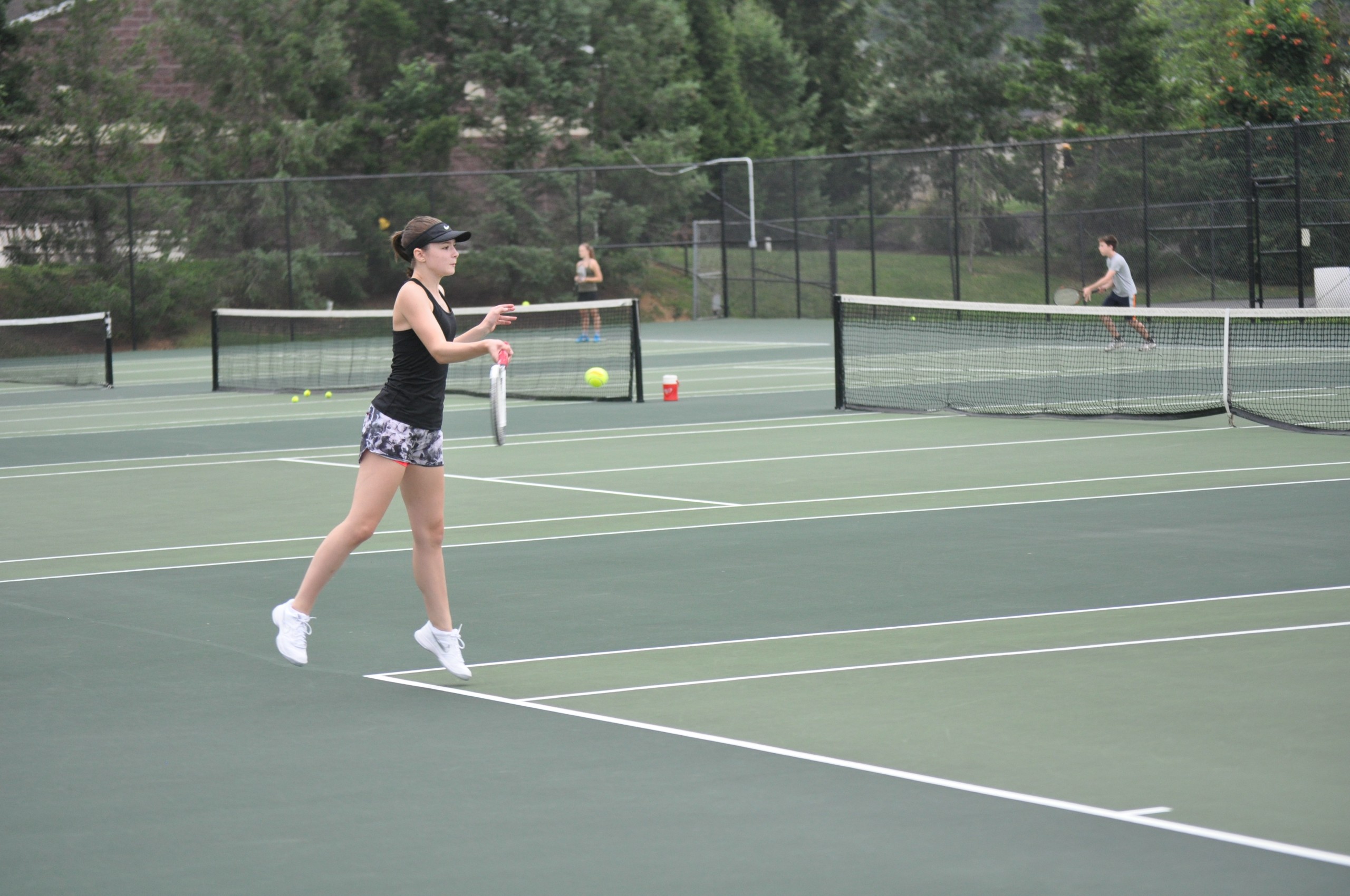 Junior Meghan Altemose working on her forehand.