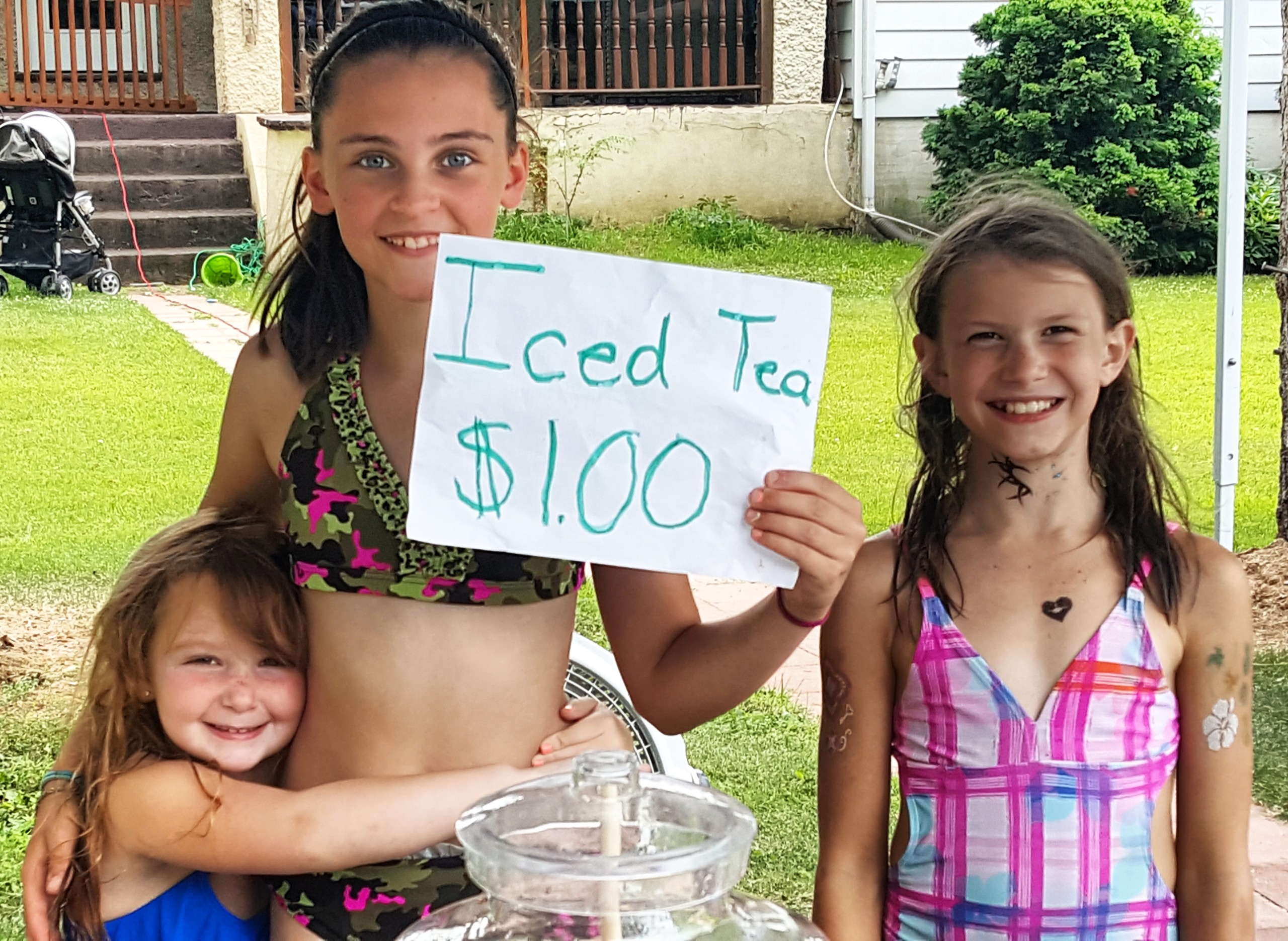 The smiling faces of sisters Abbie, Ava and Bri were hard to resist as they sold iced tea for $1.00 a glass from a stand in front of their home on Linden Avenue in Hellertown Friday, when the heat and humidity made it feel like it was almost 100 degrees outside.