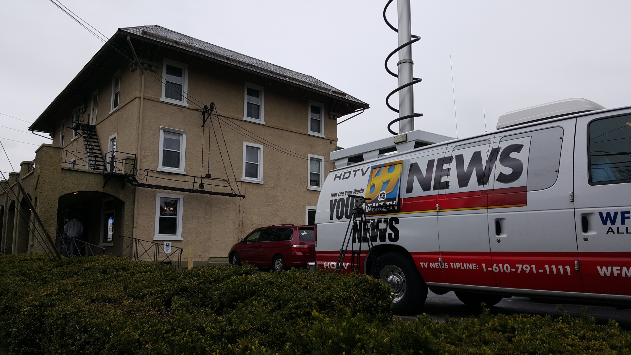 A Channel 69 News van is parked outside Crossroads Hotel in Hellertown on Friday, April 29, 2016. The local news station broadcast live from the iconic restaurant, which will close May 7.