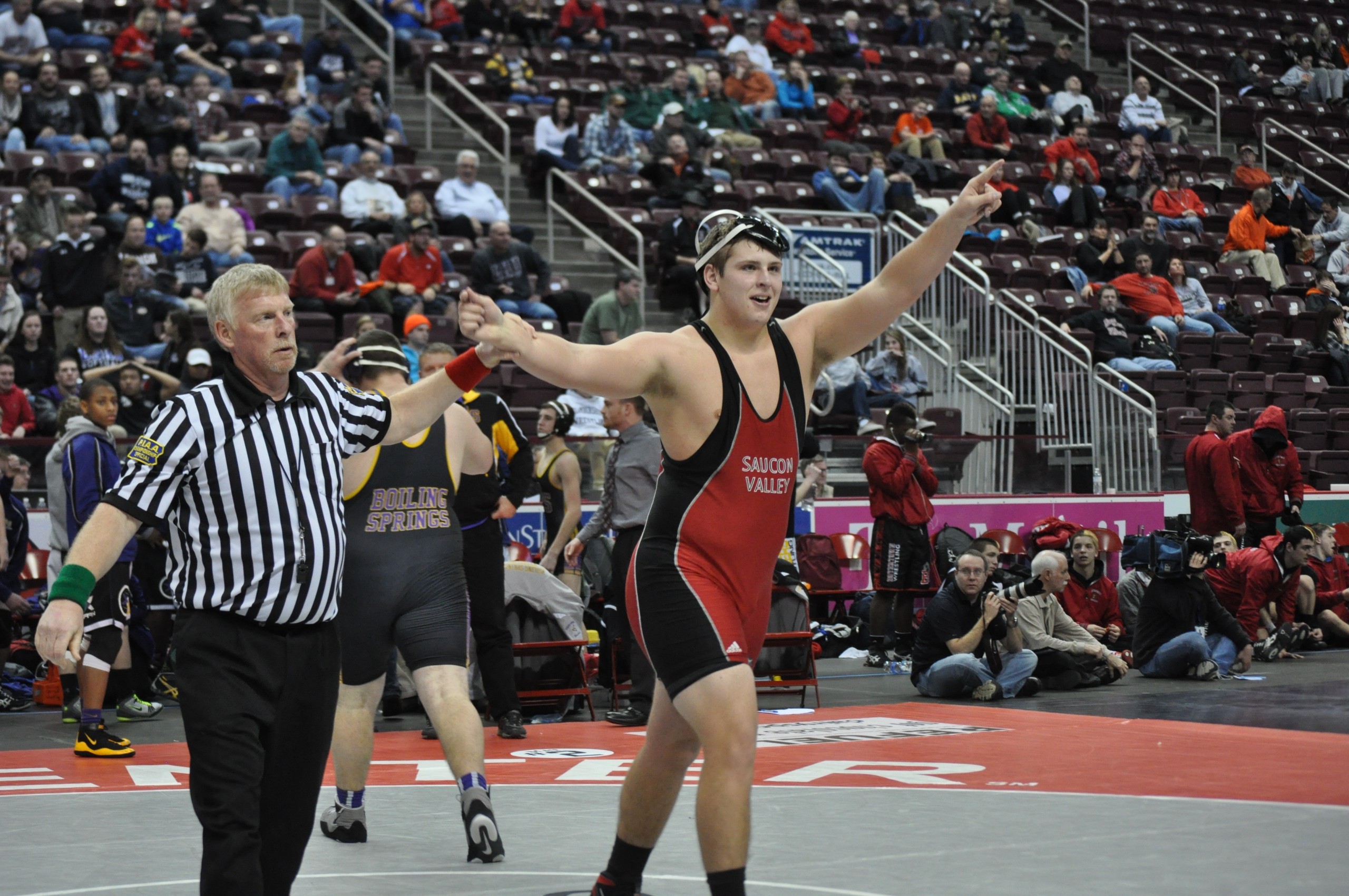 Trey Polak of Saucon Valley points the way to the finals after his pin at 285