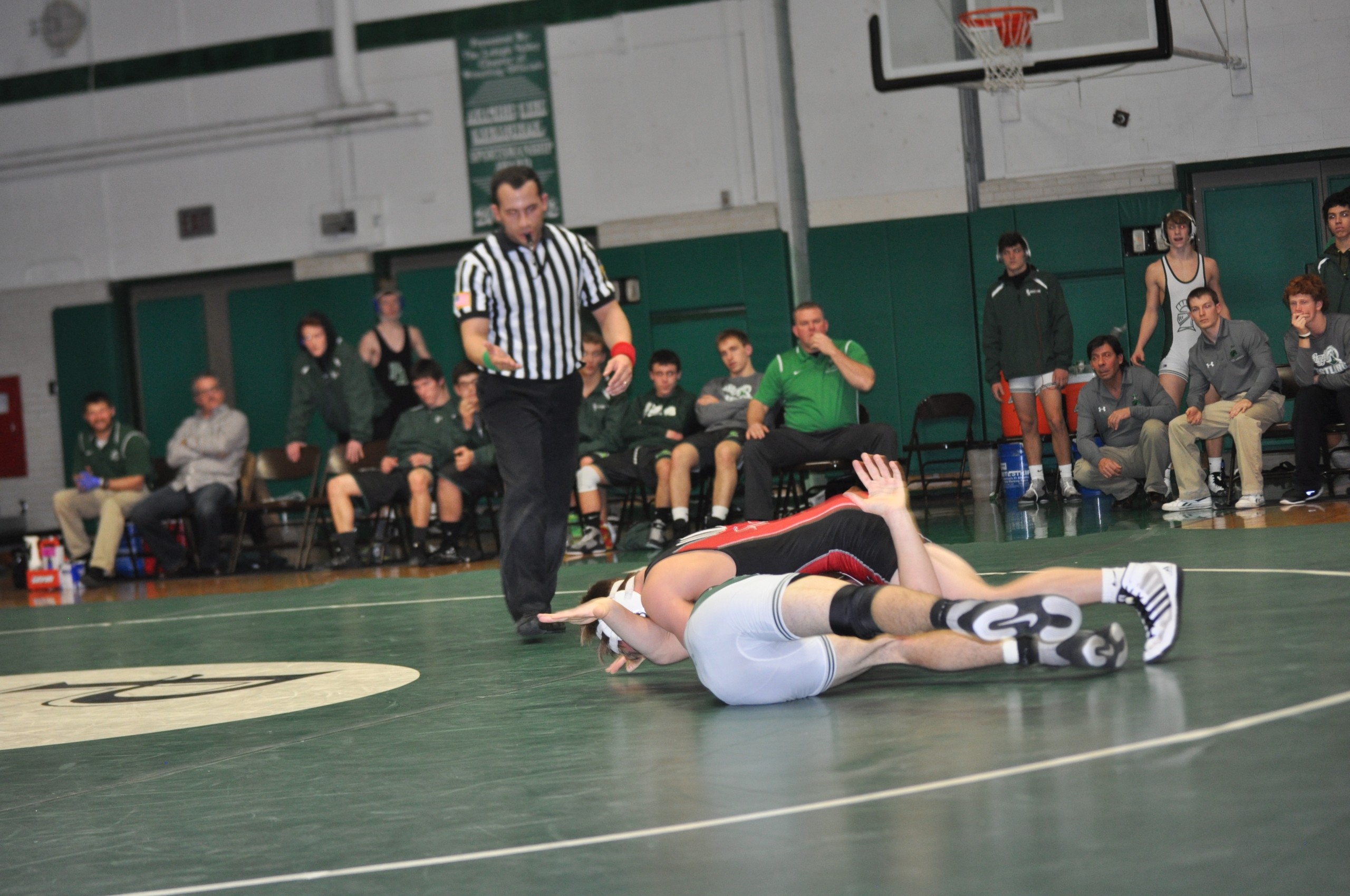 Freshman Justin Kyra wrestling like a veteran