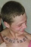 A recent photo of James Scott Cruciani Jr. posted on his Facebook page shows a distinctive tattoo on his upper chest.