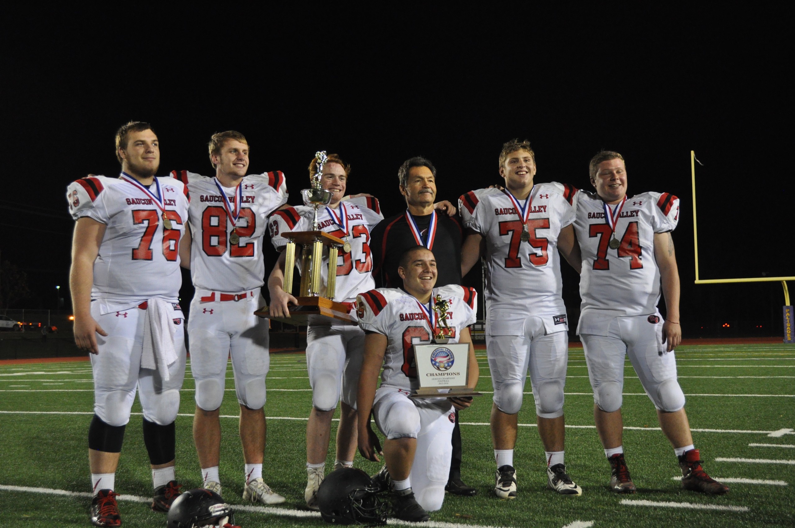 The 2015 Hogs holding the hardware