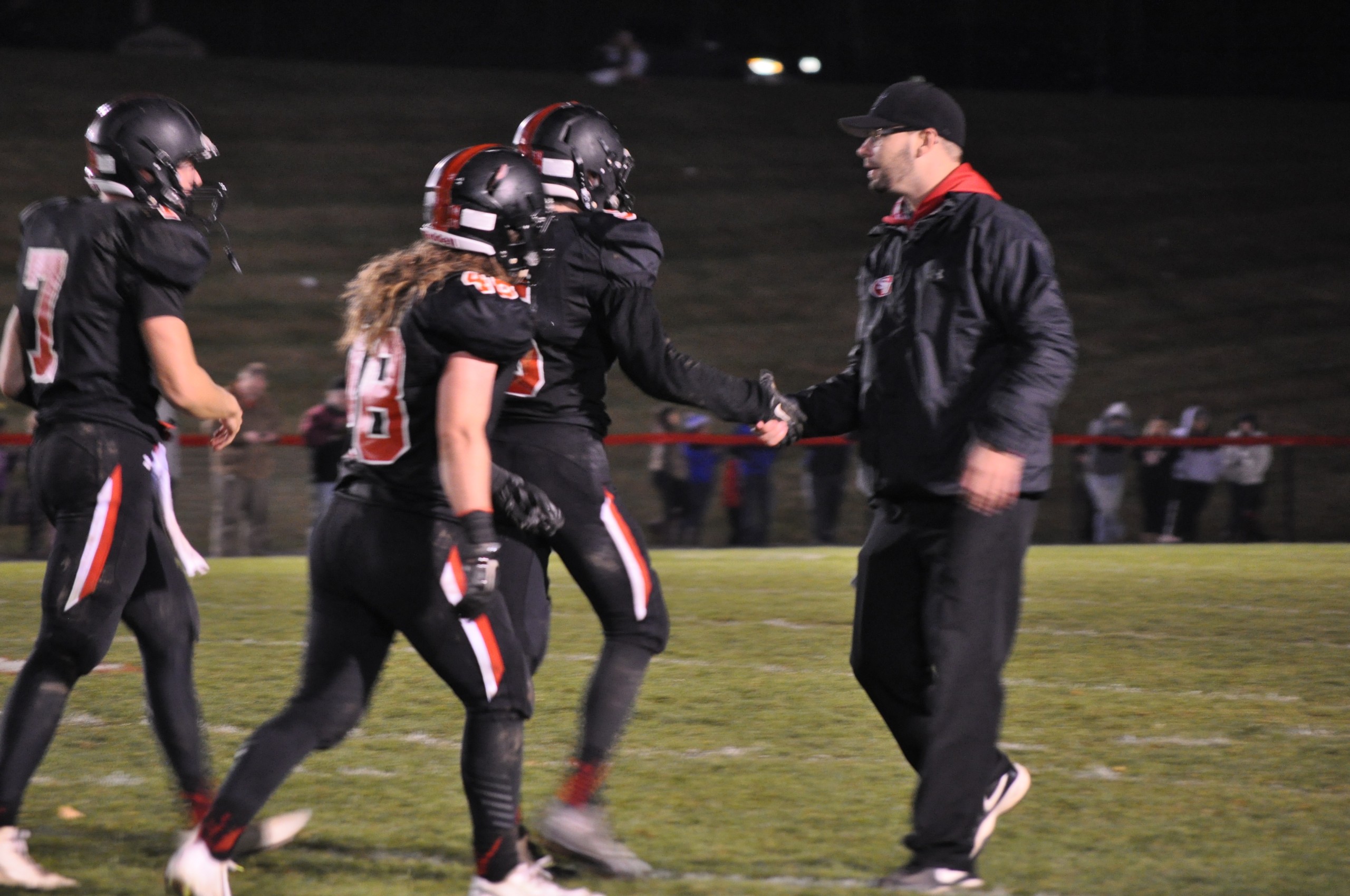 Coach Lenehan congratulates Alstan Wolfe after his heroic catch in the final seconds against Notre Dame