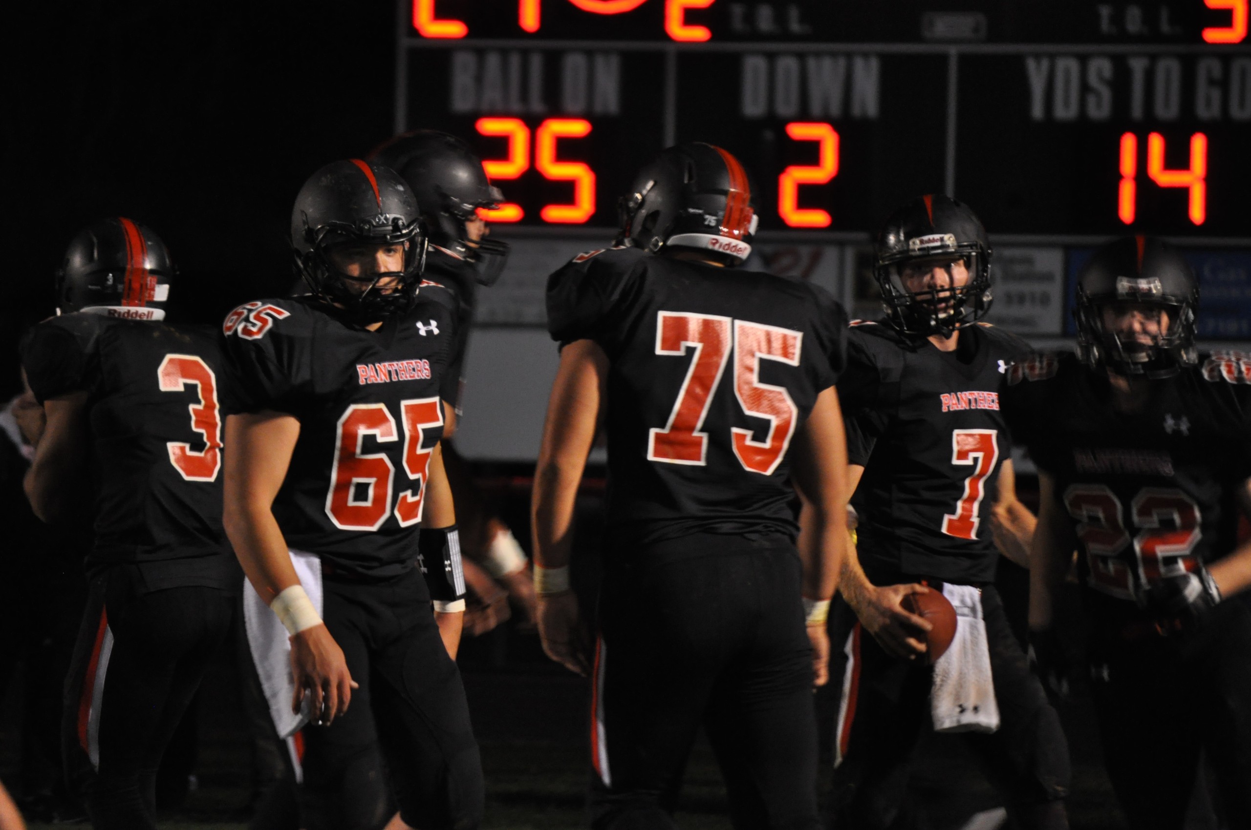 The panthers rally around Zach Thatcher after he scored one of his three rushing touchdowns