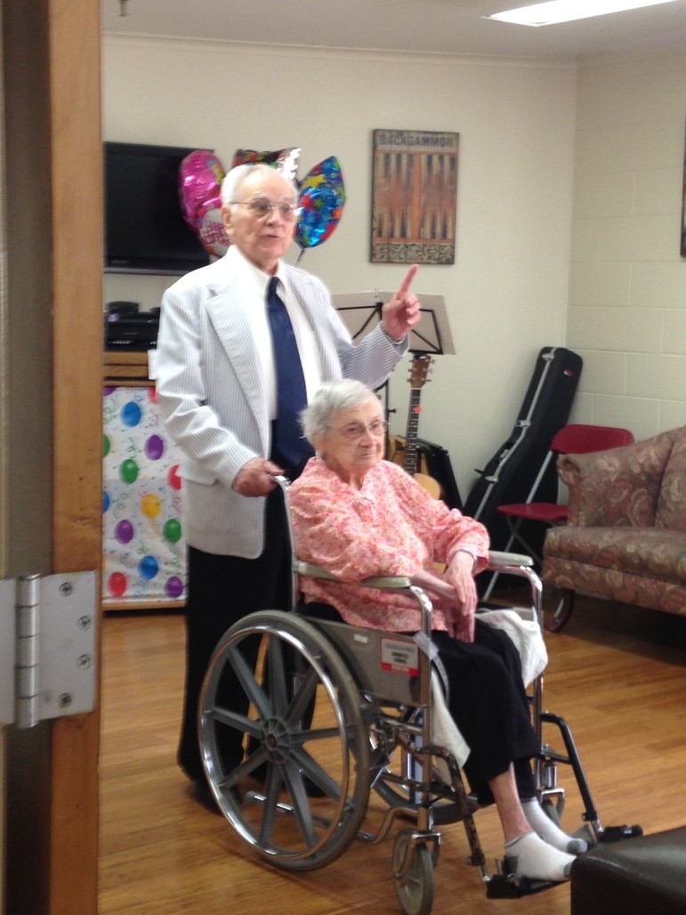 Minnie Poulton's son Harold speaks at her birthday party Sept. 27.