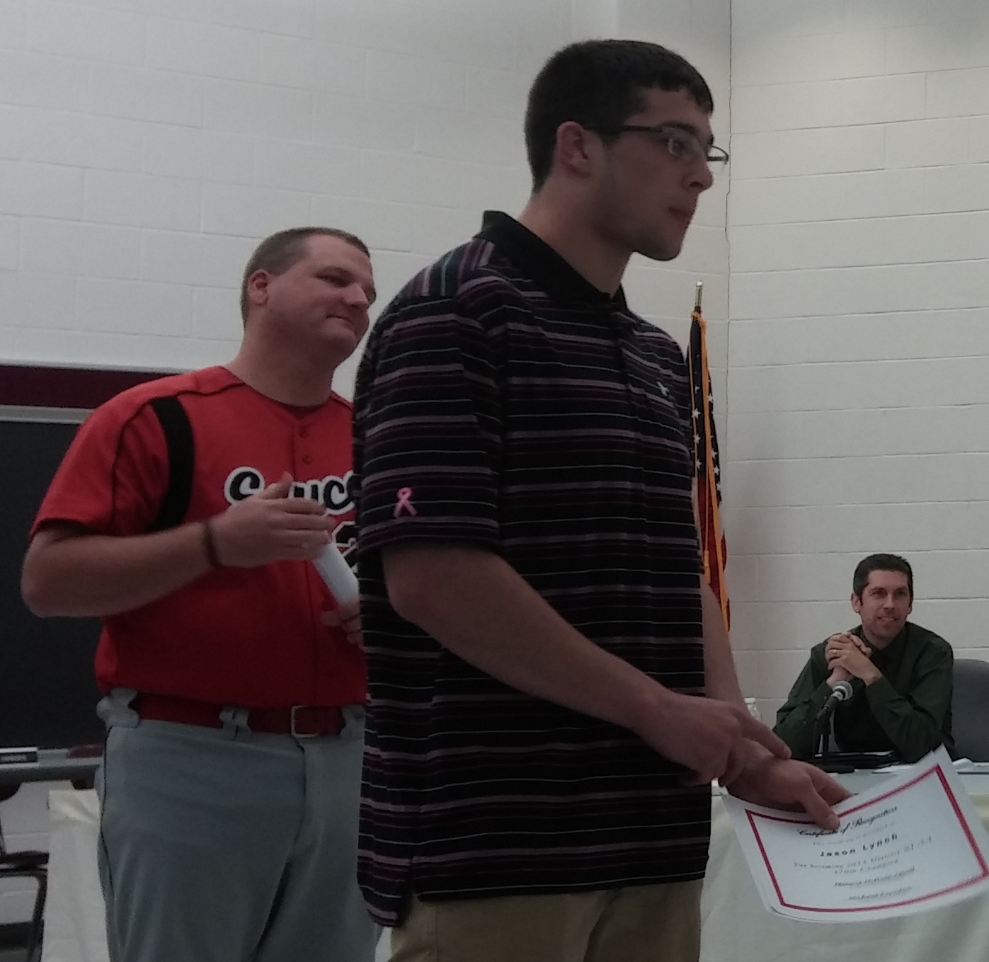Saucon Valley wrestler Jason Lynch is recognized for his achievements at the April 28, 2015 school board meeting. At left is district athletic director Bob Frey.