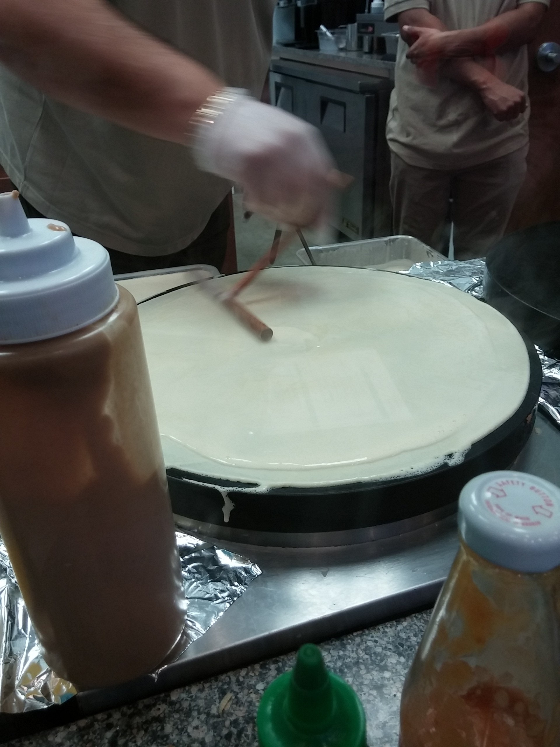 A crepe is prepared in front of customers at Crepe Soleil at the Promenade Shops at Saucon Valley.